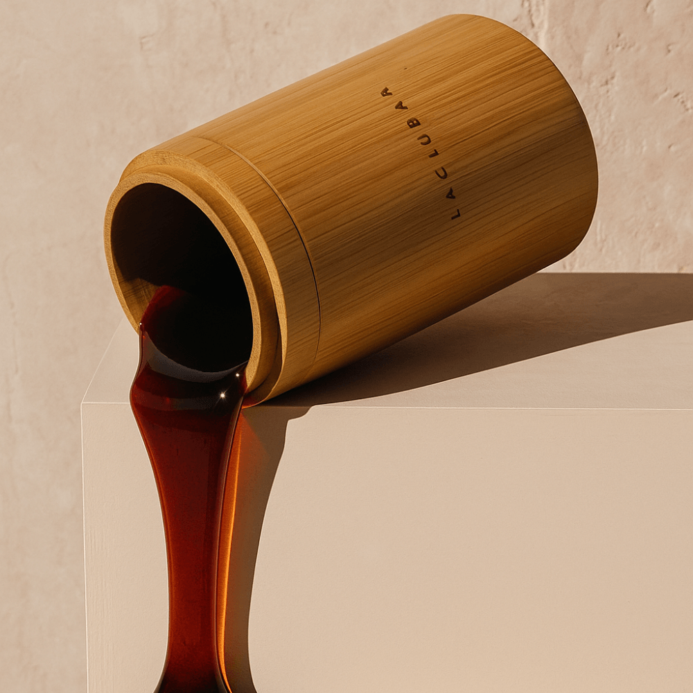 Dark raw honey flowing from the Laclubar bamboo vessel
