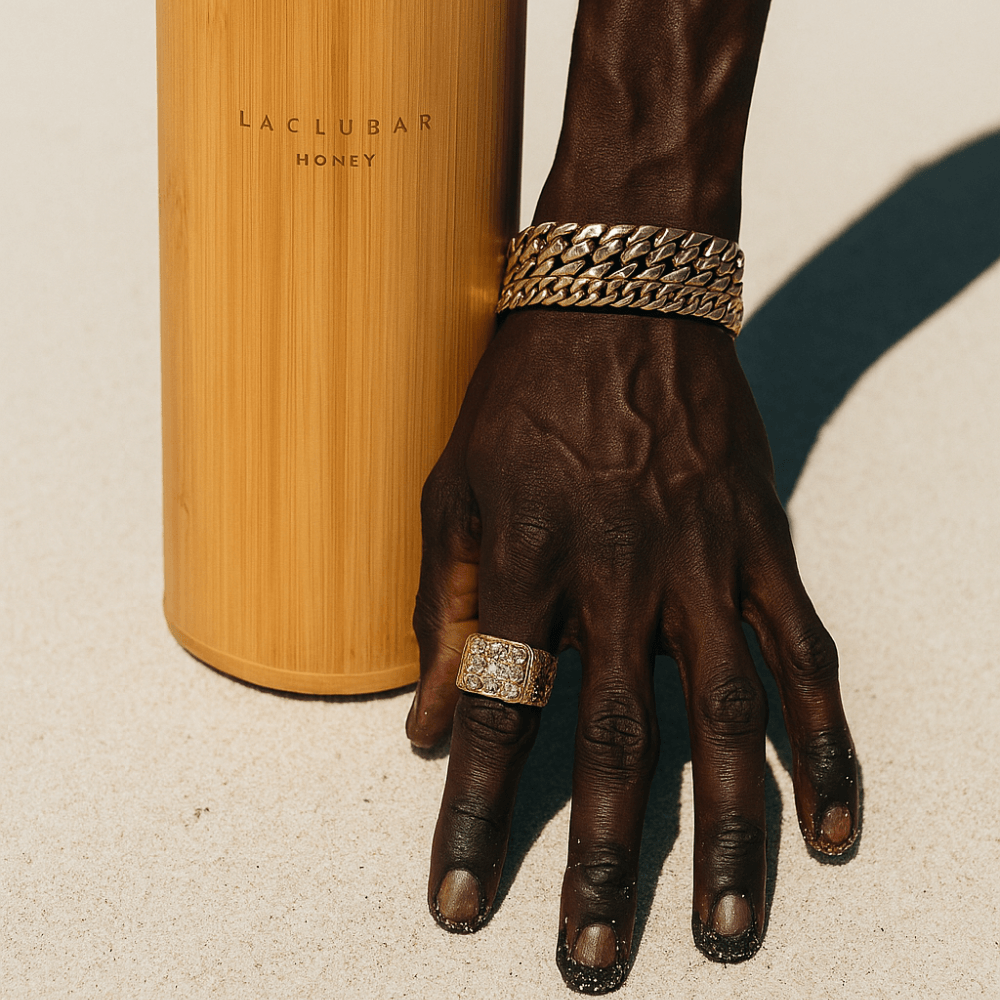 Laclubar Honey bamboo vessel beside a hand in warm Timor sunlight